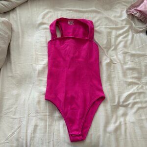 Hot pink body suit